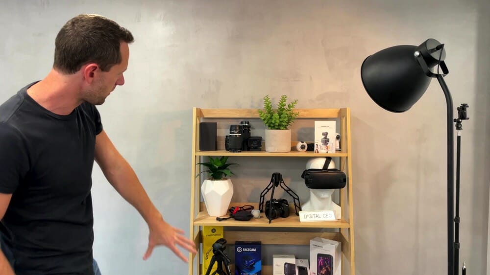 A bookshelf with various filming gear