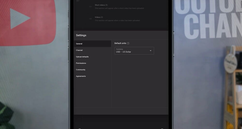 Settings menu inside YouTube Studio with General, Channel, Upload defaults, Permissions, Community, and Agreements tabs available